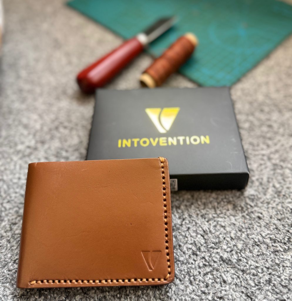 Cognac leather wallet with Intovention branded packaging